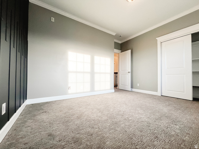 434 Cardon Ridge Drive Smithfield, UT 84335 - Photo 30 of 59 bedroom featuring carpet floors, crown molding, and a closet