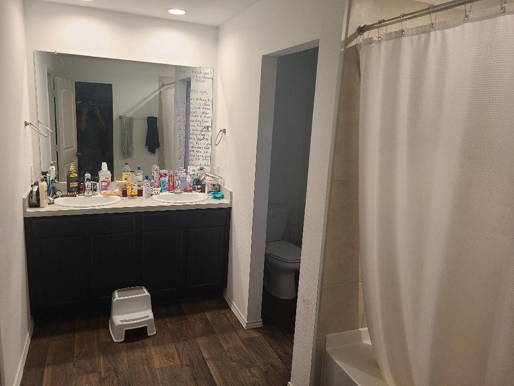 2331 Sandcherry Ln Spring Spring, TX 77373 - Photo 5 of 10 a bathroom with a sink and a mirror