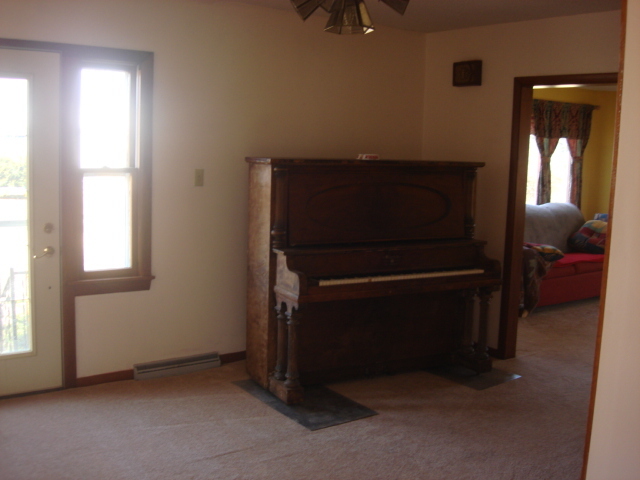 378 Van Orin Road Sublette, IL 61367 - Photo 12 of 25 a room with a chair and a window
