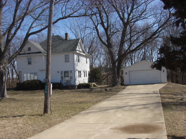 378 Van Orin Road Sublette, IL 61367 - Photo 25 of 25 a white house that has tree in front of it
