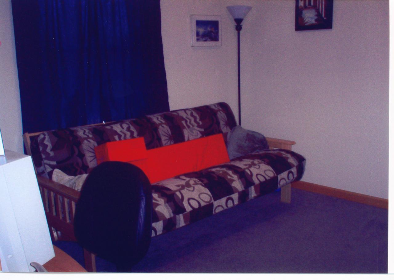679 Hampstead Road Bushkill, PA 18324 - Photo 3 of 10 a bed sitting in a bedroom next to a red wall
