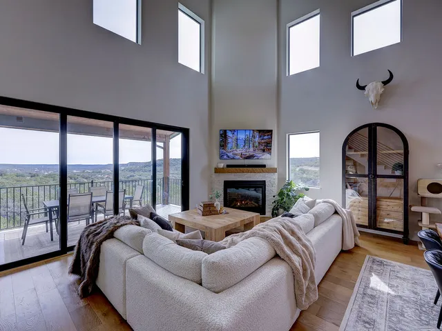 a living room with furniture and a large window