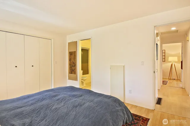 a bedroom with a bed and a table in it