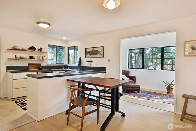 a kitchen with a table and chairs in it