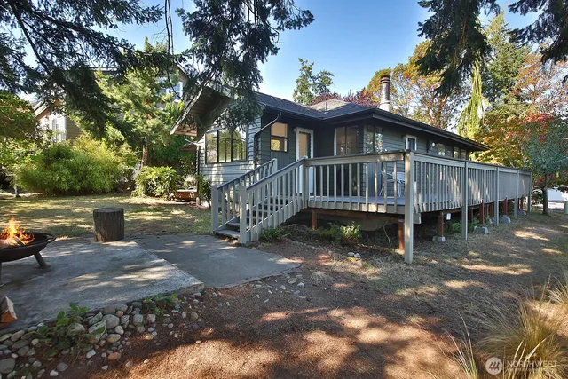 a view of a house with a yard porch and sitting area