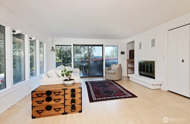 a bedroom with furniture and a fireplace