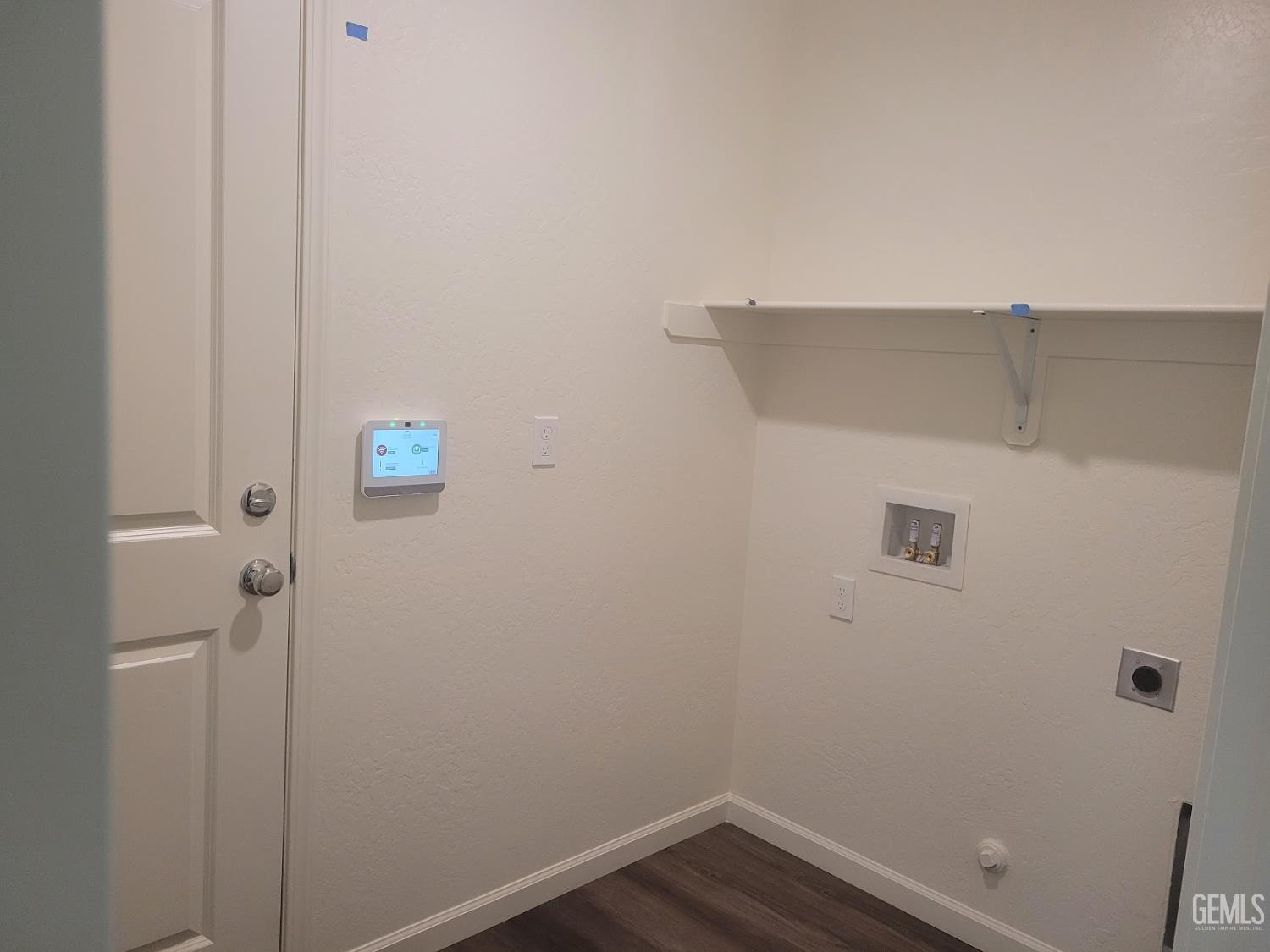Undisclosed Address Bakersfield, CA 93311 - Photo 13 of 24 a view of small space with racks on the wall