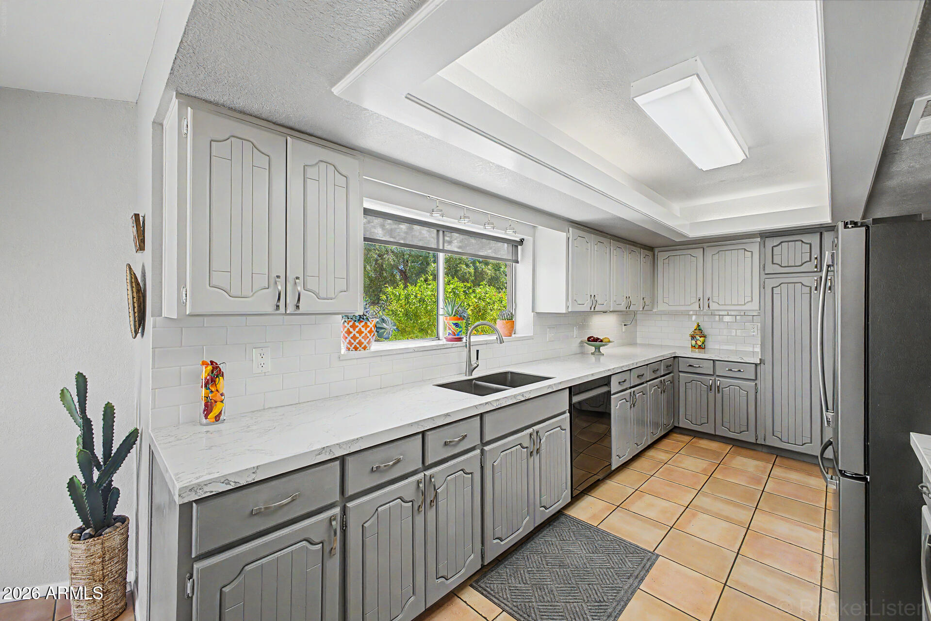 18409 East Horseshoe Bend Rio Verde, AZ 85263 - Photo 15 of 33 a kitchen with a sink window and cabinets