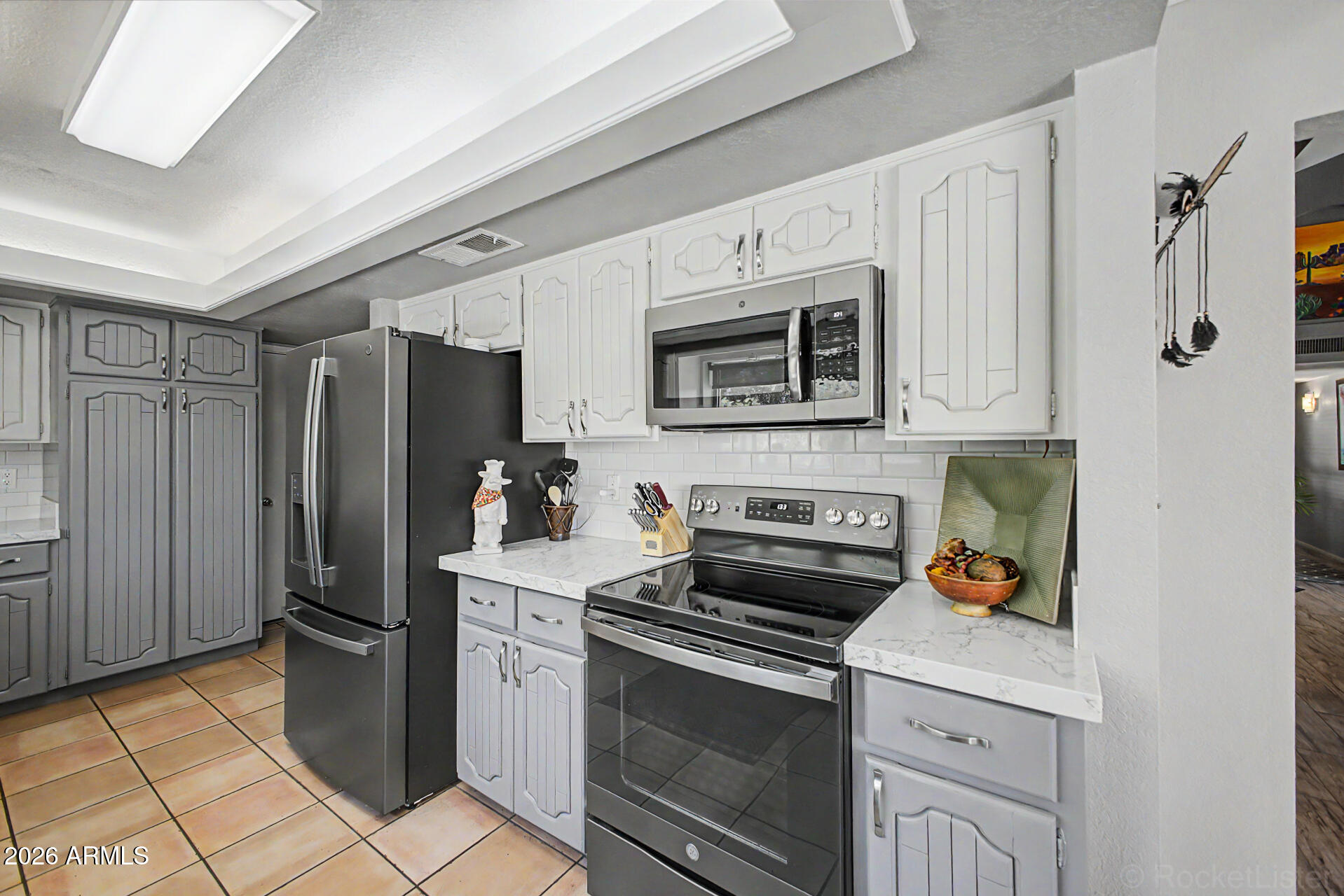 18409 East Horseshoe Bend Rio Verde, AZ 85263 - Photo 16 of 33 a kitchen with stainless steel appliances a stove microwave and refrigerator