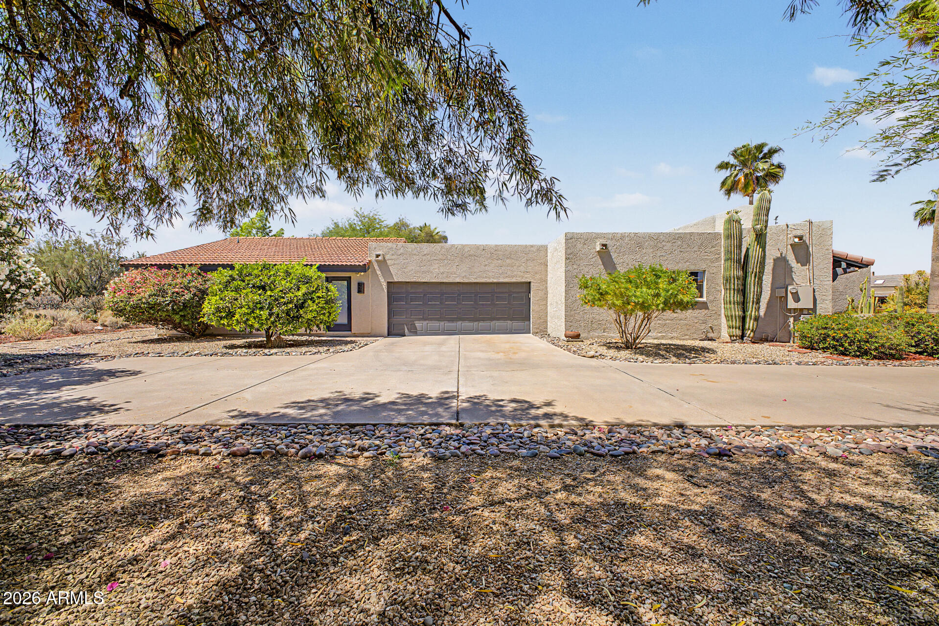 18409 East Horseshoe Bend Rio Verde, AZ 85263 - Photo 26 of 33 a front view of a house with a yard and garage