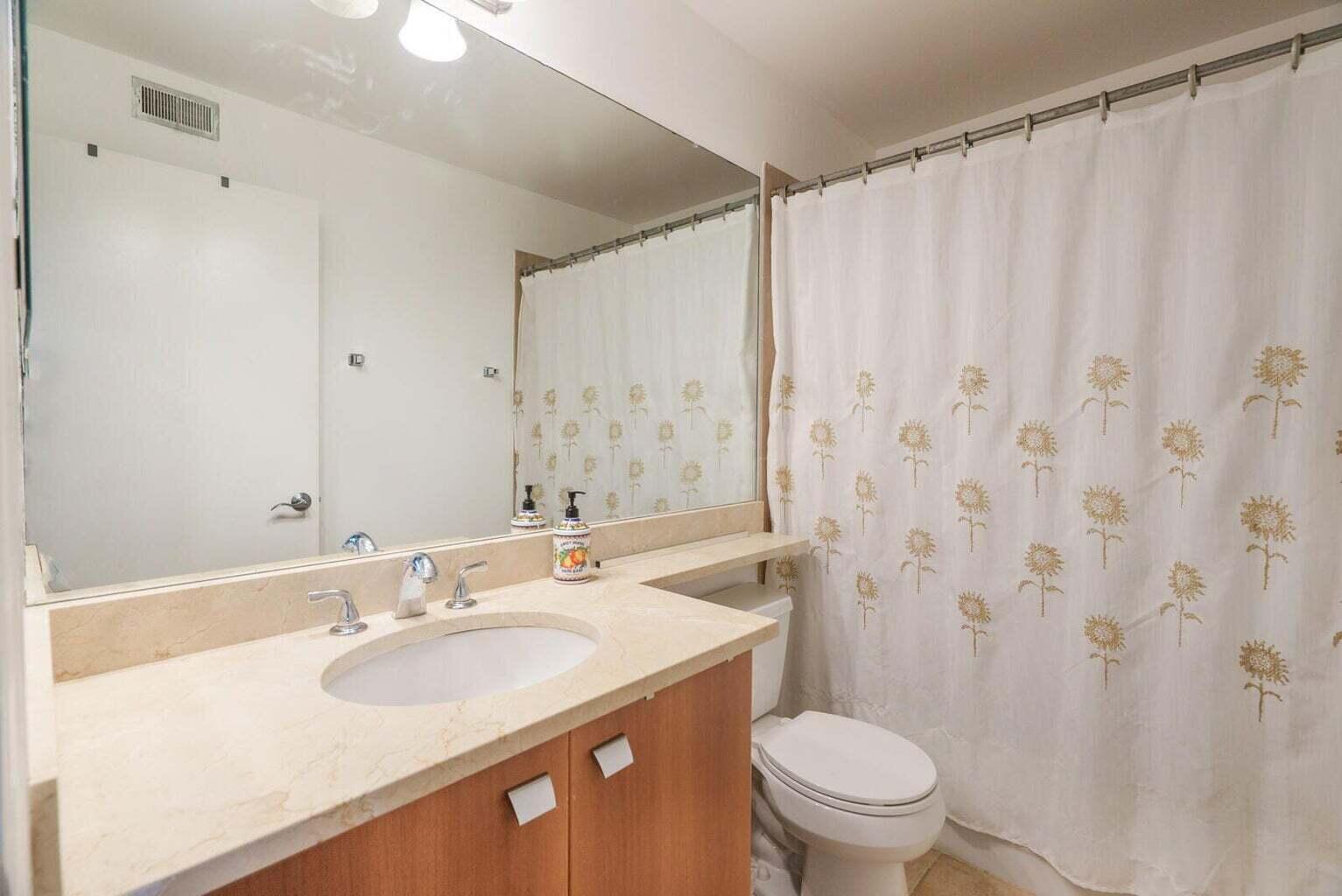 1050 Crystal Way, Unit P Delray Beach, FL 33444 - Photo 11 of 17 a bathroom with a sink toilet and shower