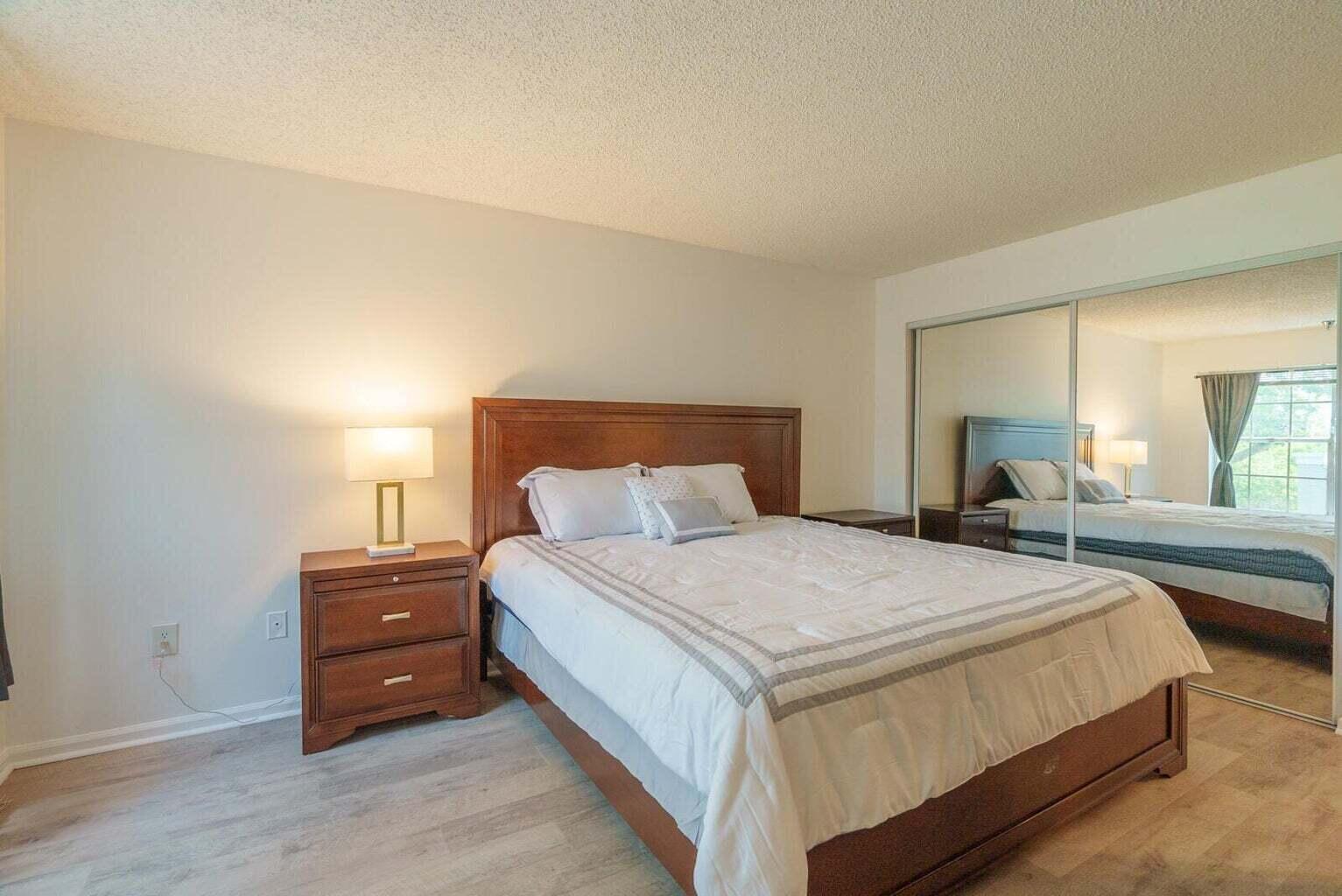 1050 Crystal Way, Unit P Delray Beach, FL 33444 - Photo 5 of 17 a bedroom with a bed and window