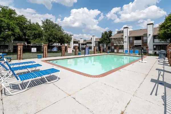 a view of a swimming pool with a lounge chairs
