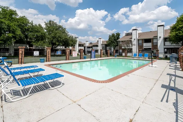 a view of a swimming pool with a lounge chairs