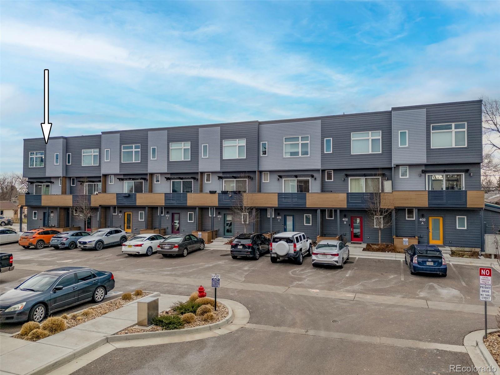 402 West Baseline Road, Unit H Lafayette, CO 80026 - Photo 36 of 37 a car parked in front of a building