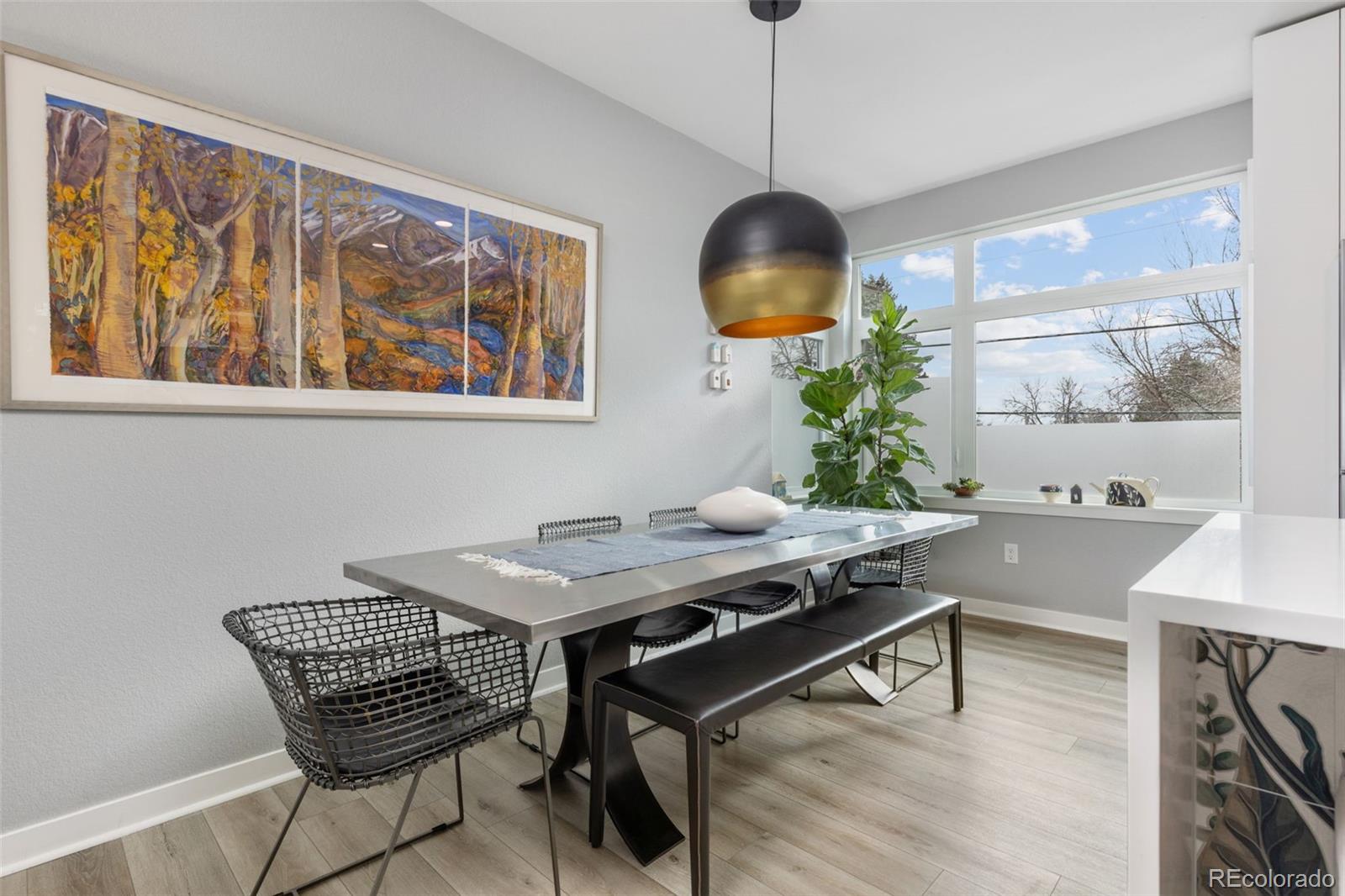 402 West Baseline Road, Unit H Lafayette, CO 80026 - Photo 9 of 37 a view of a workspace with furniture window and wooden floor