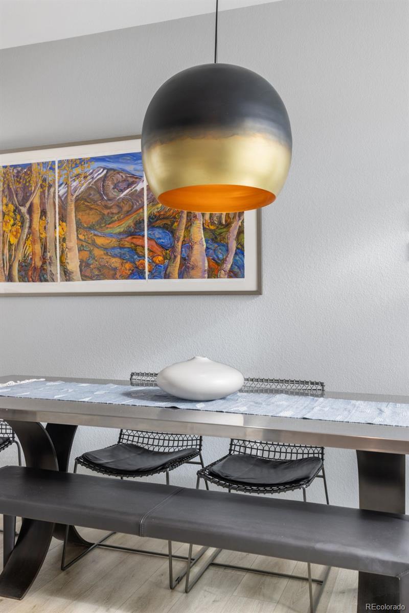 402 West Baseline Road, Unit H Lafayette, CO 80026 - Photo 10 of 37 a table with a vase and flowers on it