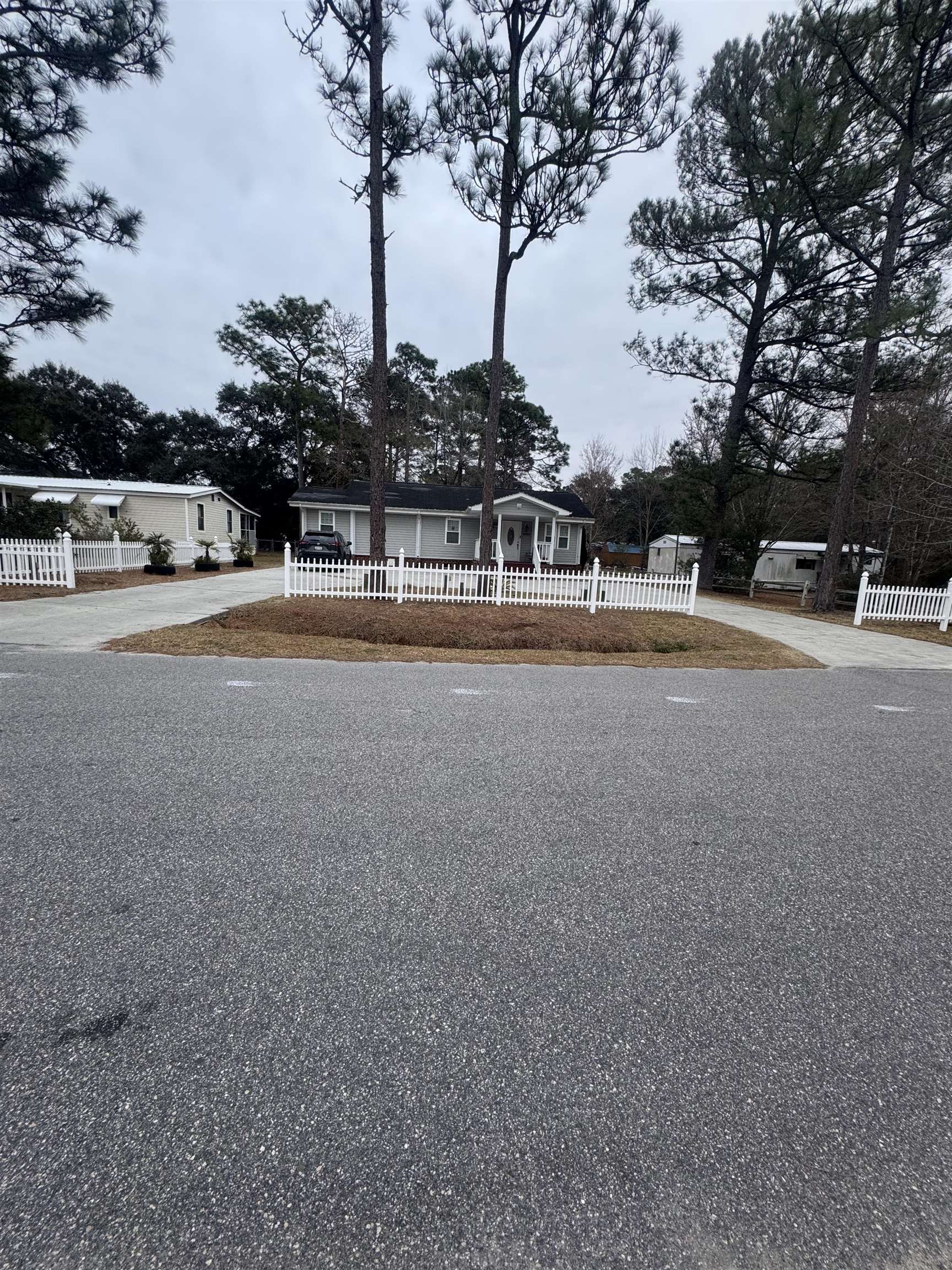 2427 Huntington Circle Conway, SC 29526 - Photo 16 of 19 View of front of house with a fenced front yard and concrete driveway