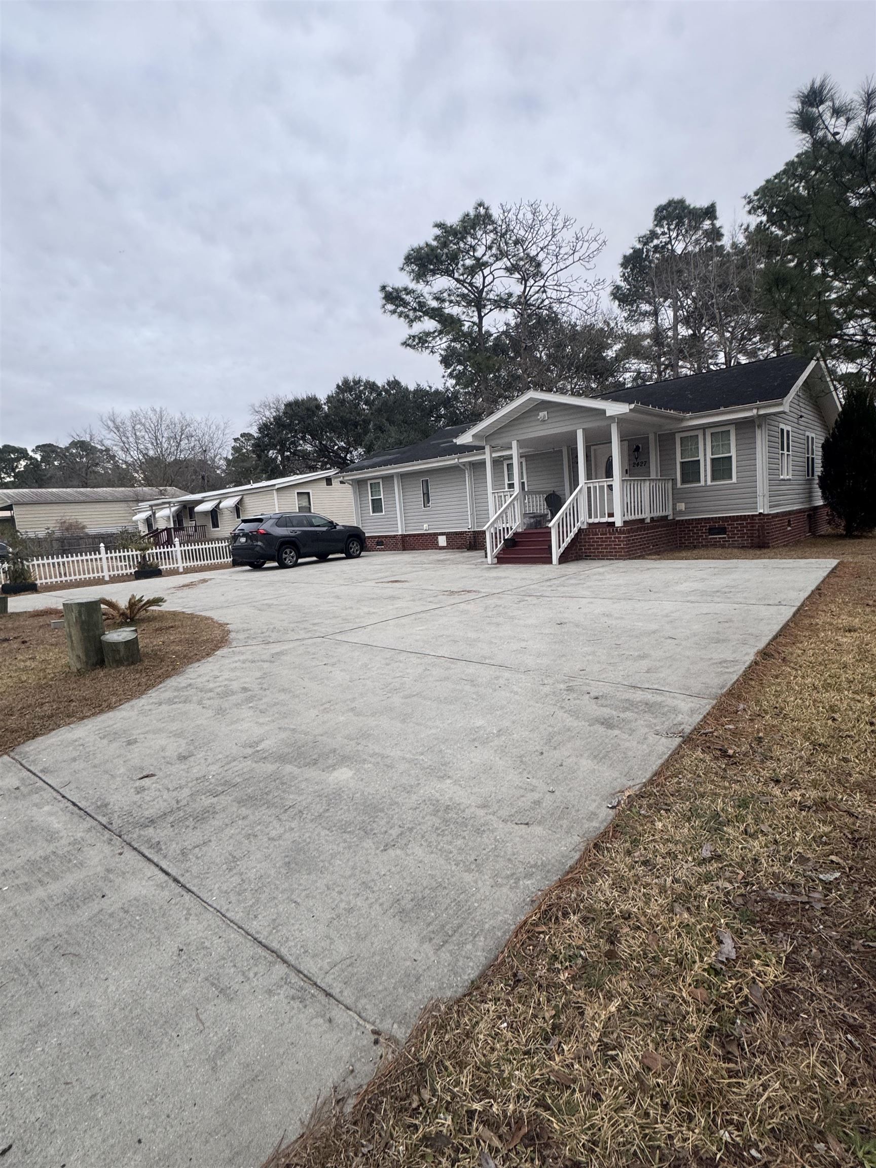 2427 Huntington Circle Conway, SC 29526 - Photo 17 of 19 View of front of house with crawl space, a porch, and driveway