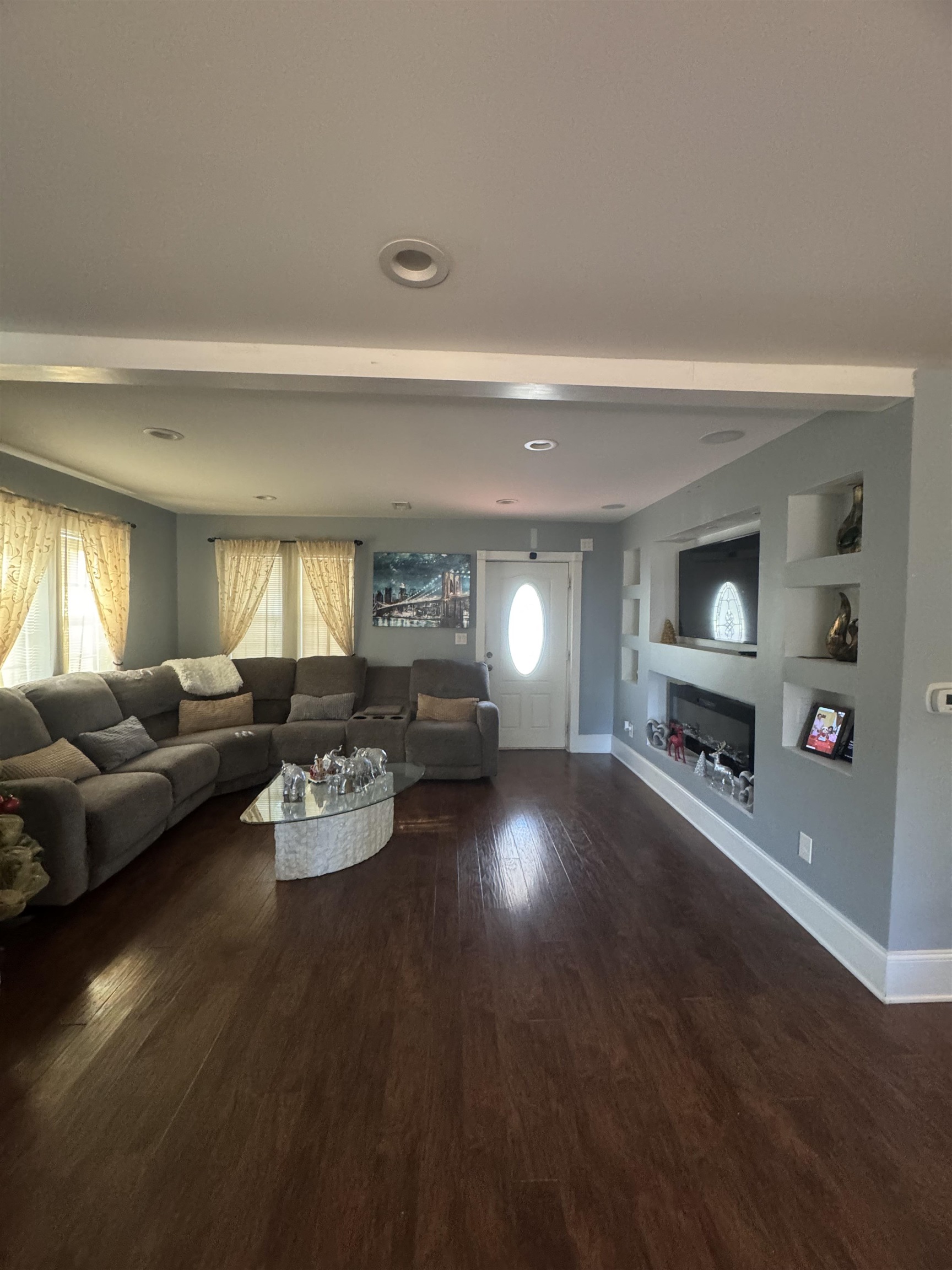 2427 Huntington Circle Conway, SC 29526 - Photo 3 of 19 Living area with built in features and dark wood-style flooring