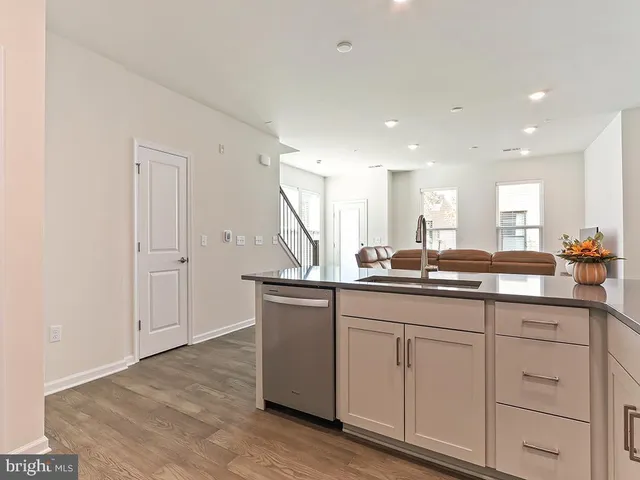 a kitchen with sink and cabinets