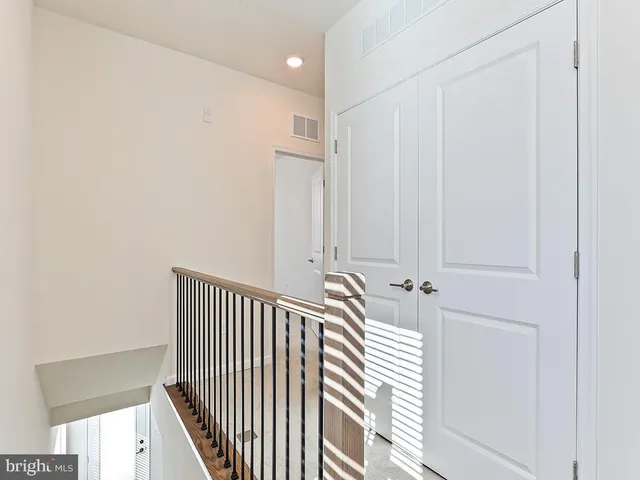a view of a hallway with a window