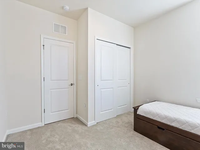 a room with a bed and a closet