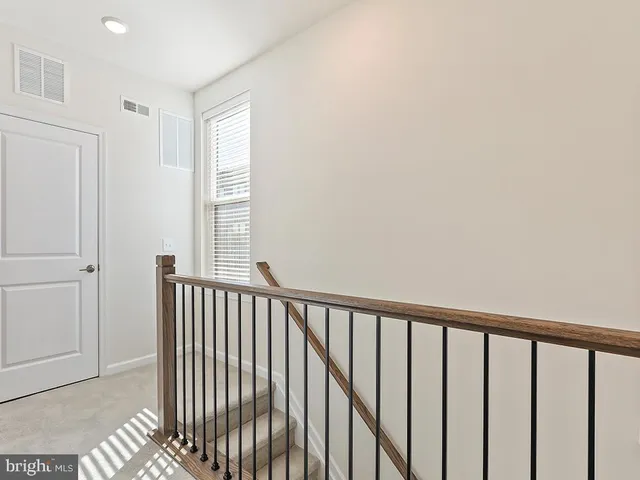a view of a balcony with wooden floor