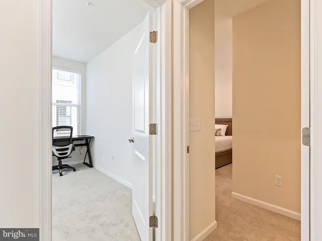 a view of a hallway with closet area