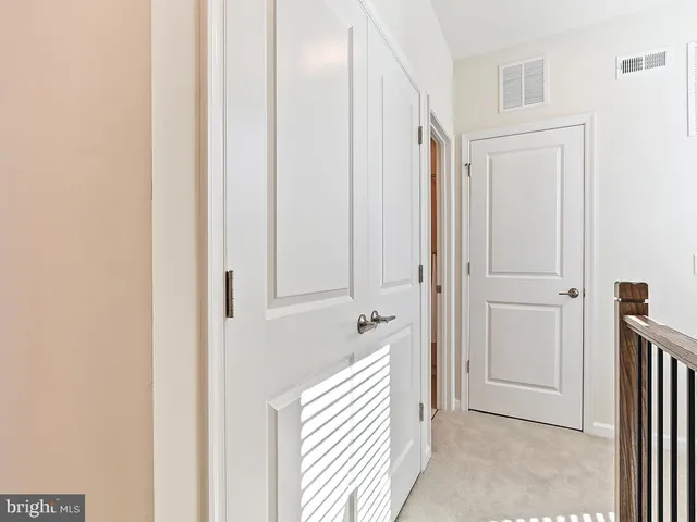 a room with a bed and a television