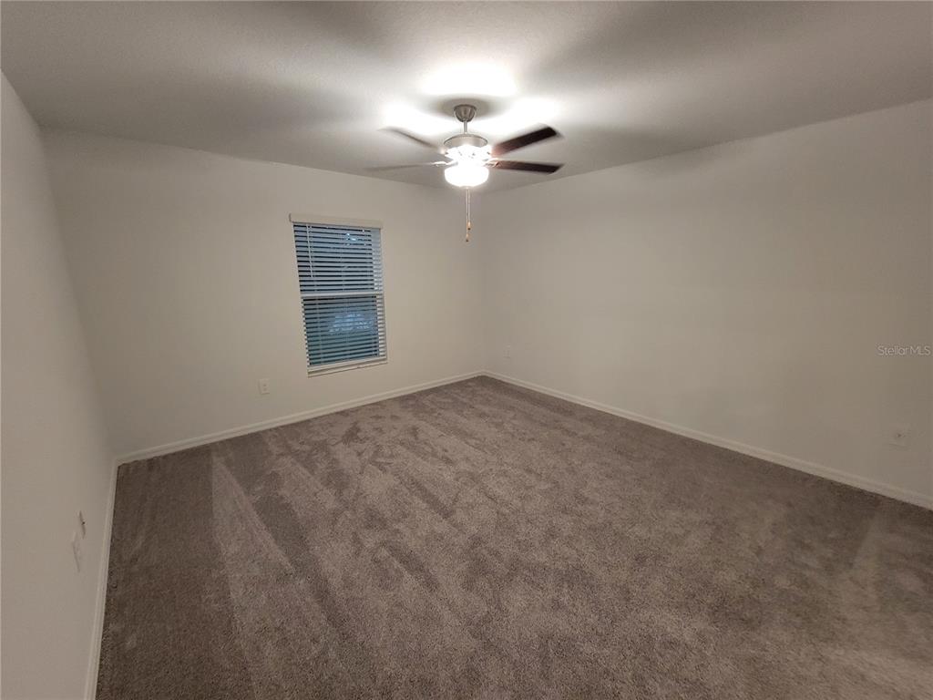 1844 Red Loop Lakeland, FL 33801 - Photo 15 of 24 an empty room with a window and a fan