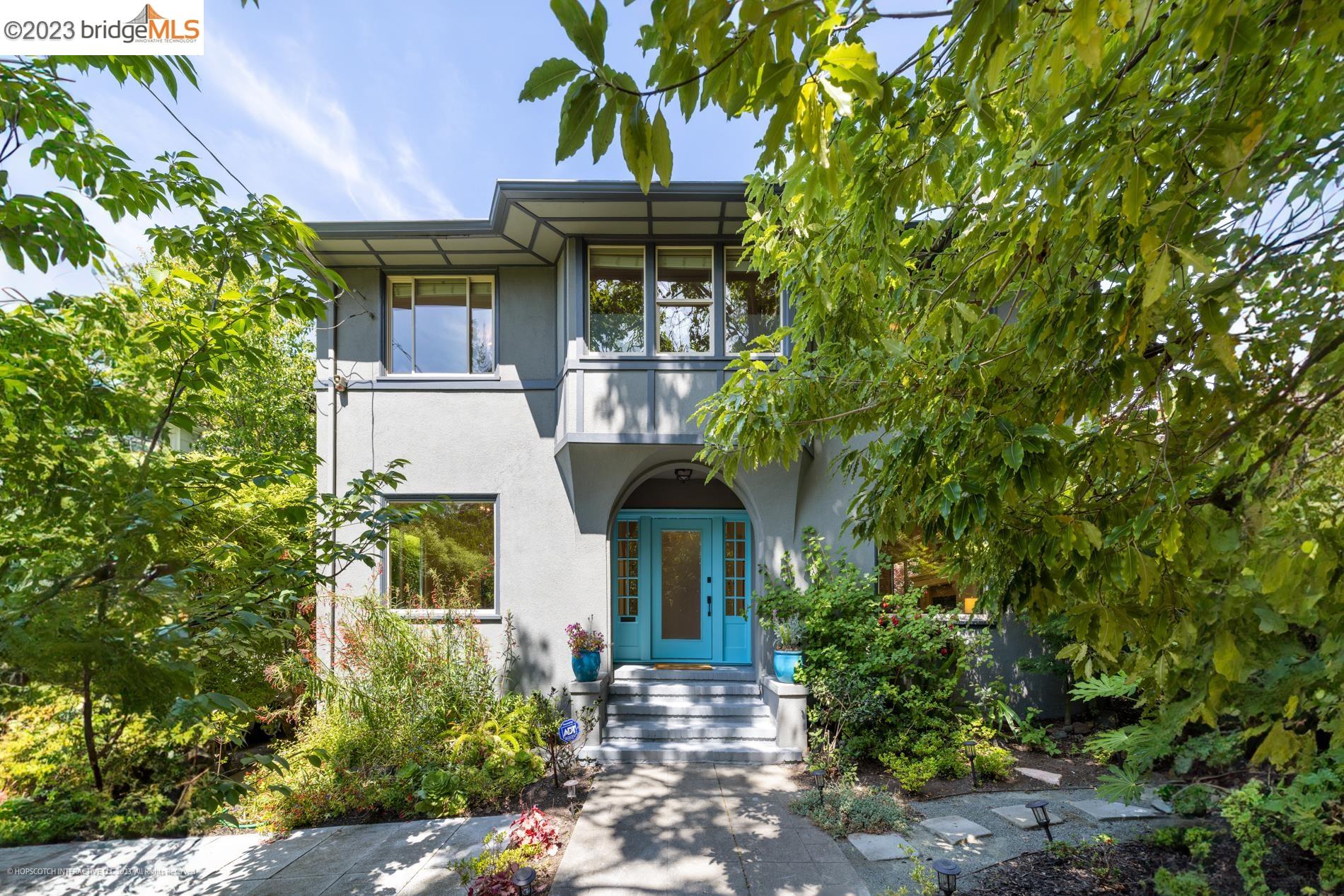 73 Tunnel Road Berkeley, CA 94705 - Photo 1 of 1 a front view of a house with a garden