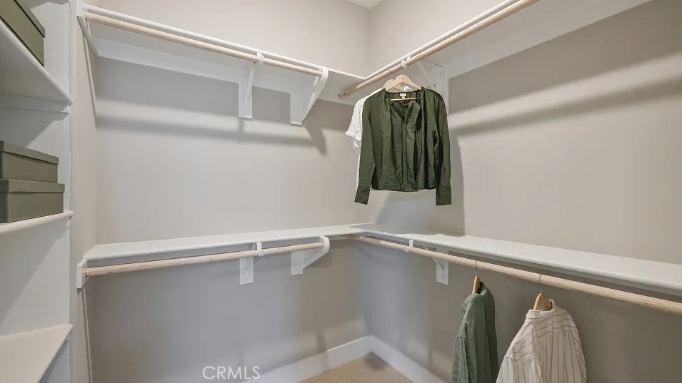 1022 Currant Road Fullerton, CA 92833 - Photo 10 of 25 a view of walk in closet with clothes and shoes