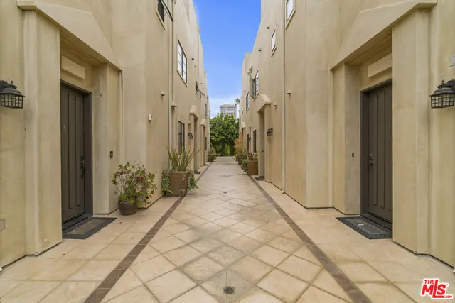 a view of a pathway along the house