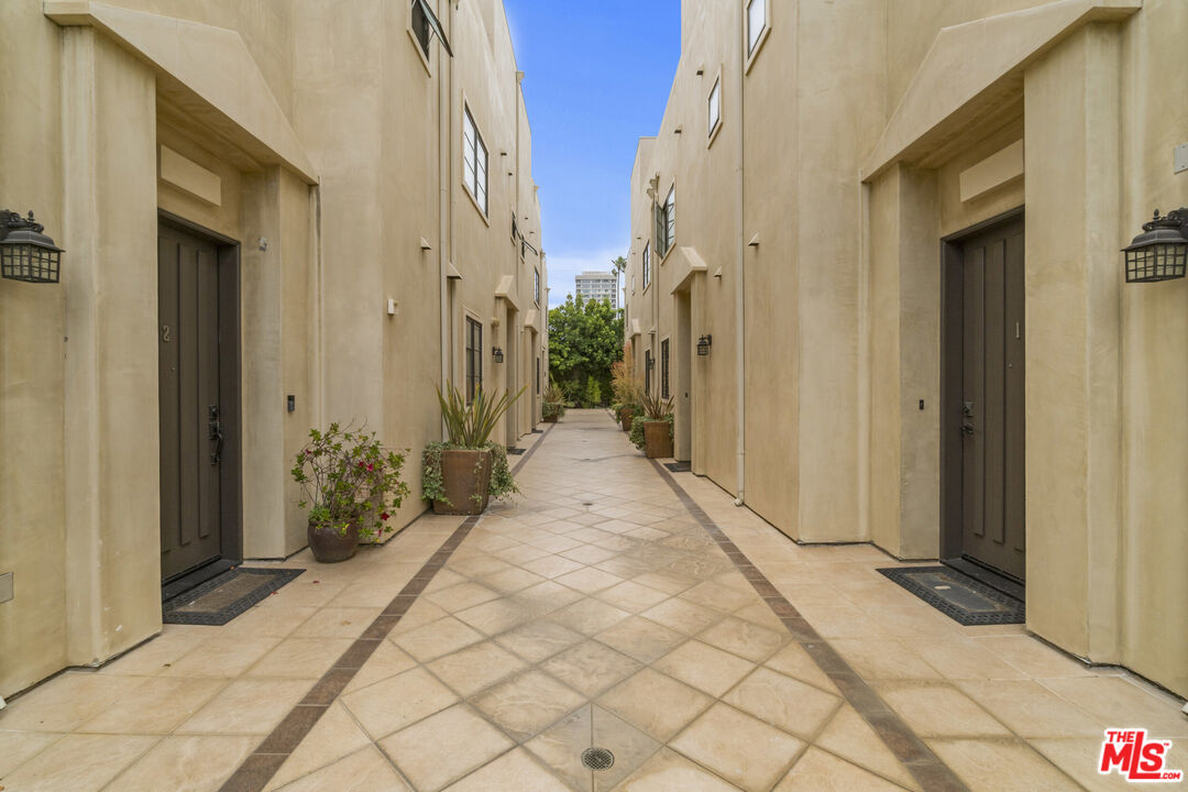 10765 Wilkins Avenue, Unit 8 Los Angeles, CA 90024 - Photo 2 of 33 a view of a pathway along the house