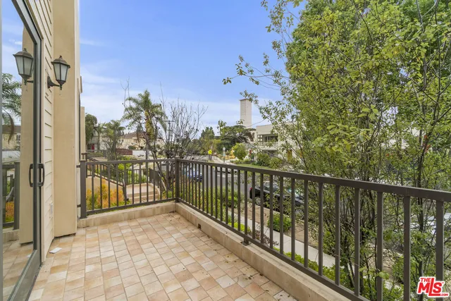 a view of a balcony with city view