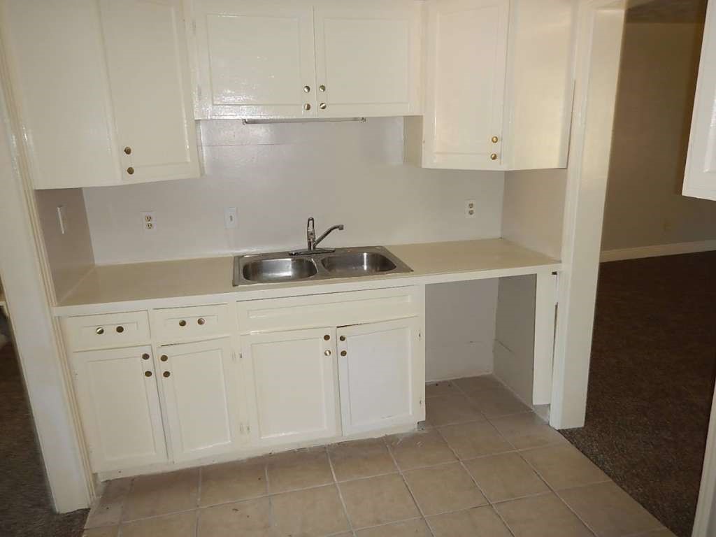 3614 Cosby Street Houston, TX 77021 - Photo 6 of 16 a kitchen with white cabinets and sink