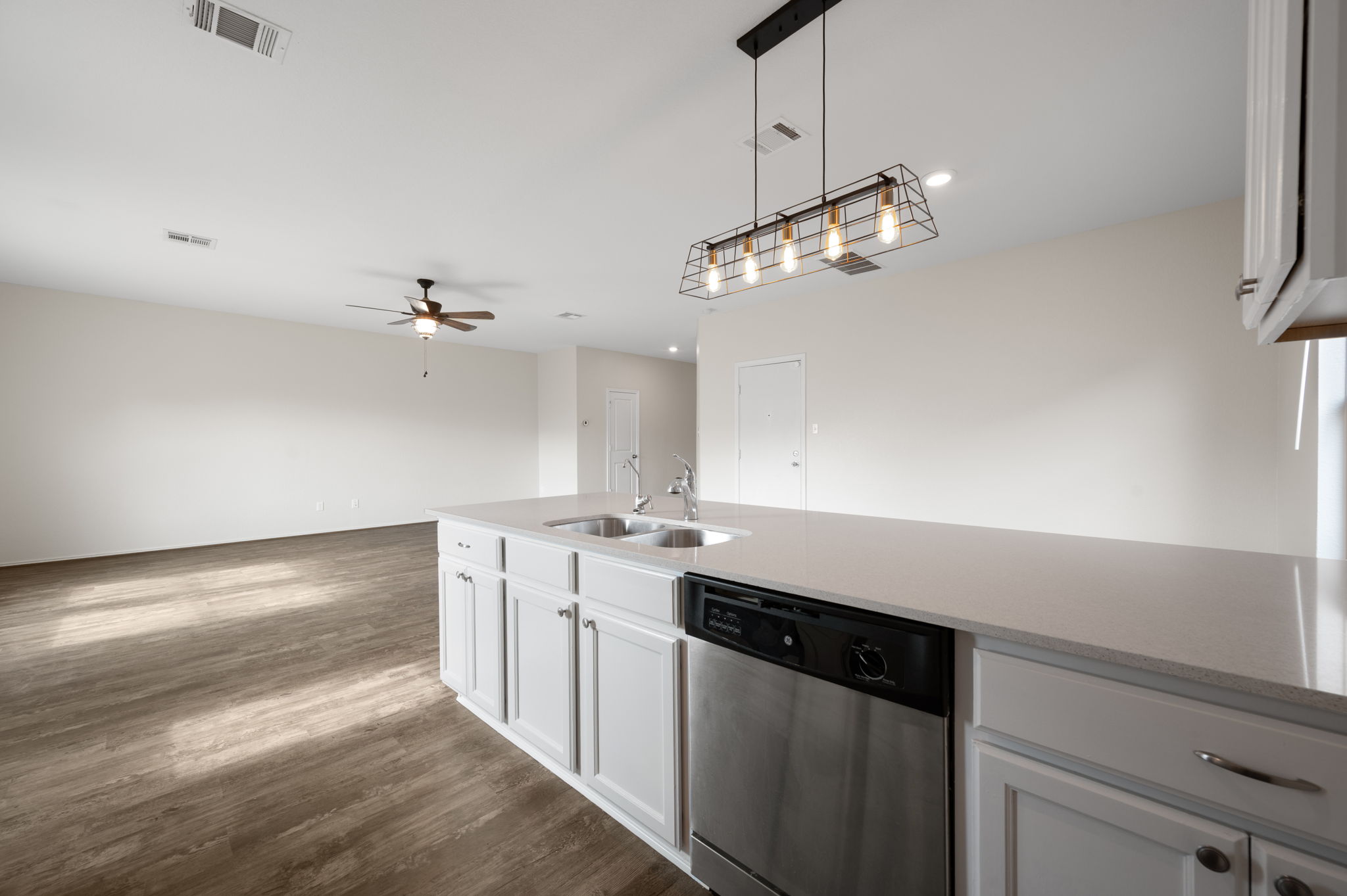 817 Circle Way Jarrell, TX 76537 - Photo 11 of 39 a kitchen with a sink and chandelier