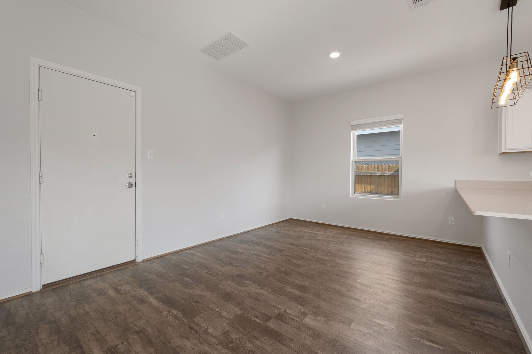 817 Circle Way Jarrell, TX 76537 - Photo 15 of 39 an empty room with wooden floor and windows