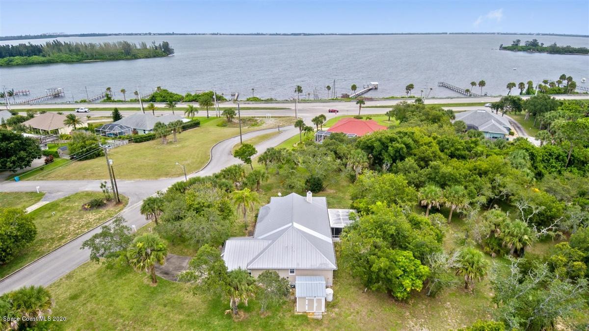 5551 Senne Road Micco, FL 32976 - Photo 2 of 37 a view of a lake with outdoor space and trees all around