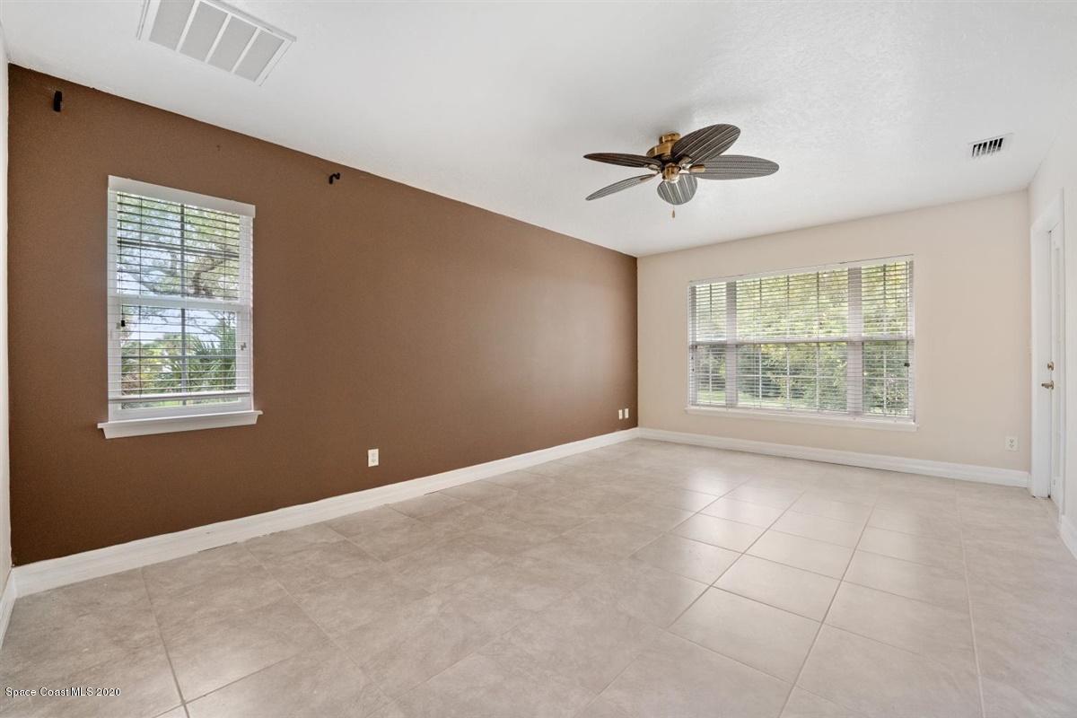 5551 Senne Road Micco, FL 32976 - Photo 12 of 37 a view of a livingroom with a ceiling fan and window