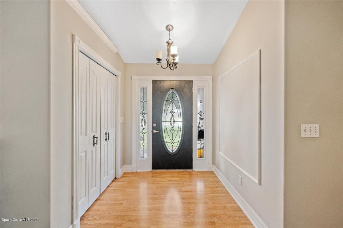5551 Senne Road Micco, FL 32976 - Photo 3 of 37 a view of a hallway with windows