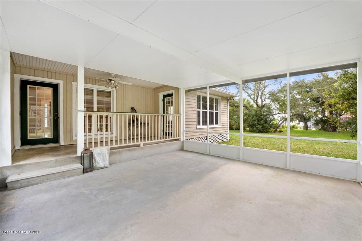 5551 Senne Road Micco, FL 32976 - Photo 24 of 37 a view of livingroom with deck area and garden