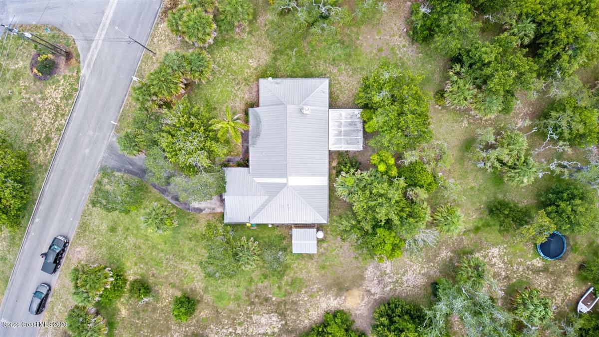 5551 Senne Road Micco, FL 32976 - Photo 28 of 37 an aerial view of a house with a yard and garden