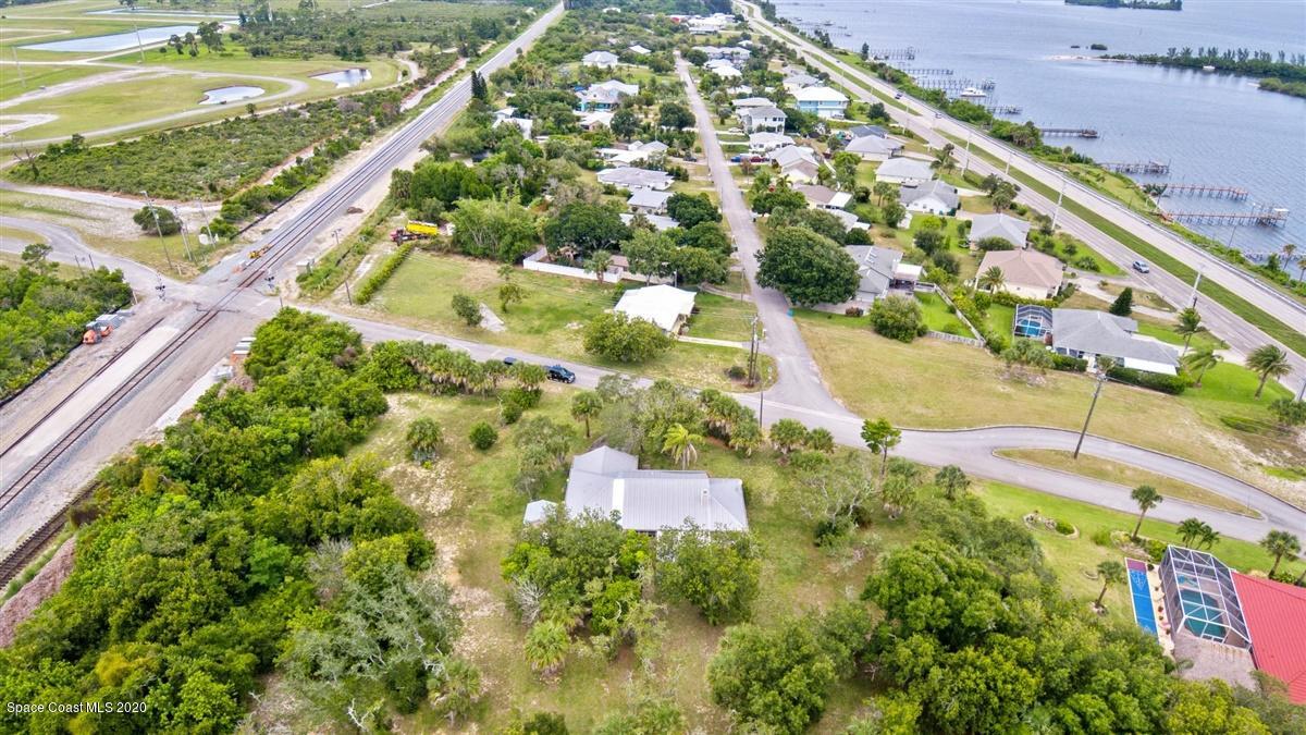 5551 Senne Road Micco, FL 32976 - Photo 29 of 37 an aerial view of residential houses with outdoor space and street view