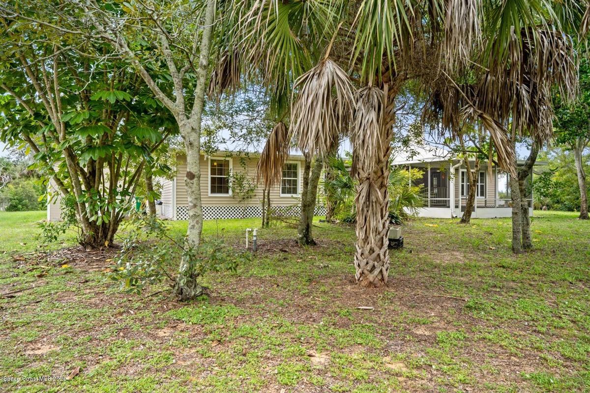 5551 Senne Road Micco, FL 32976 - Photo 31 of 37 a view of a house with a tree in the yard