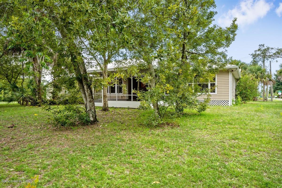 5551 Senne Road Micco, FL 32976 - Photo 32 of 37 a view of a backyard with large trees