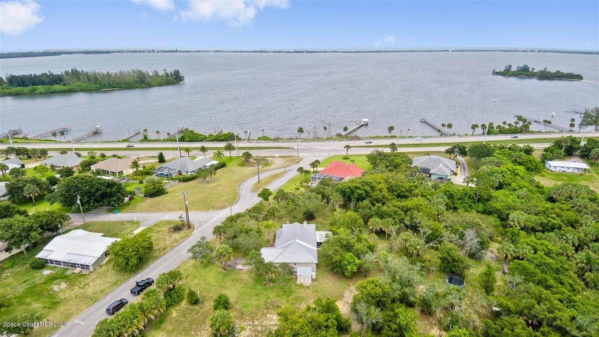 5551 Senne Road Micco, FL 32976 - Photo 36 of 37 a view of a lake with a city