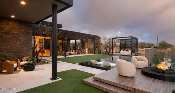 a living room with furniture and a floor to ceiling window