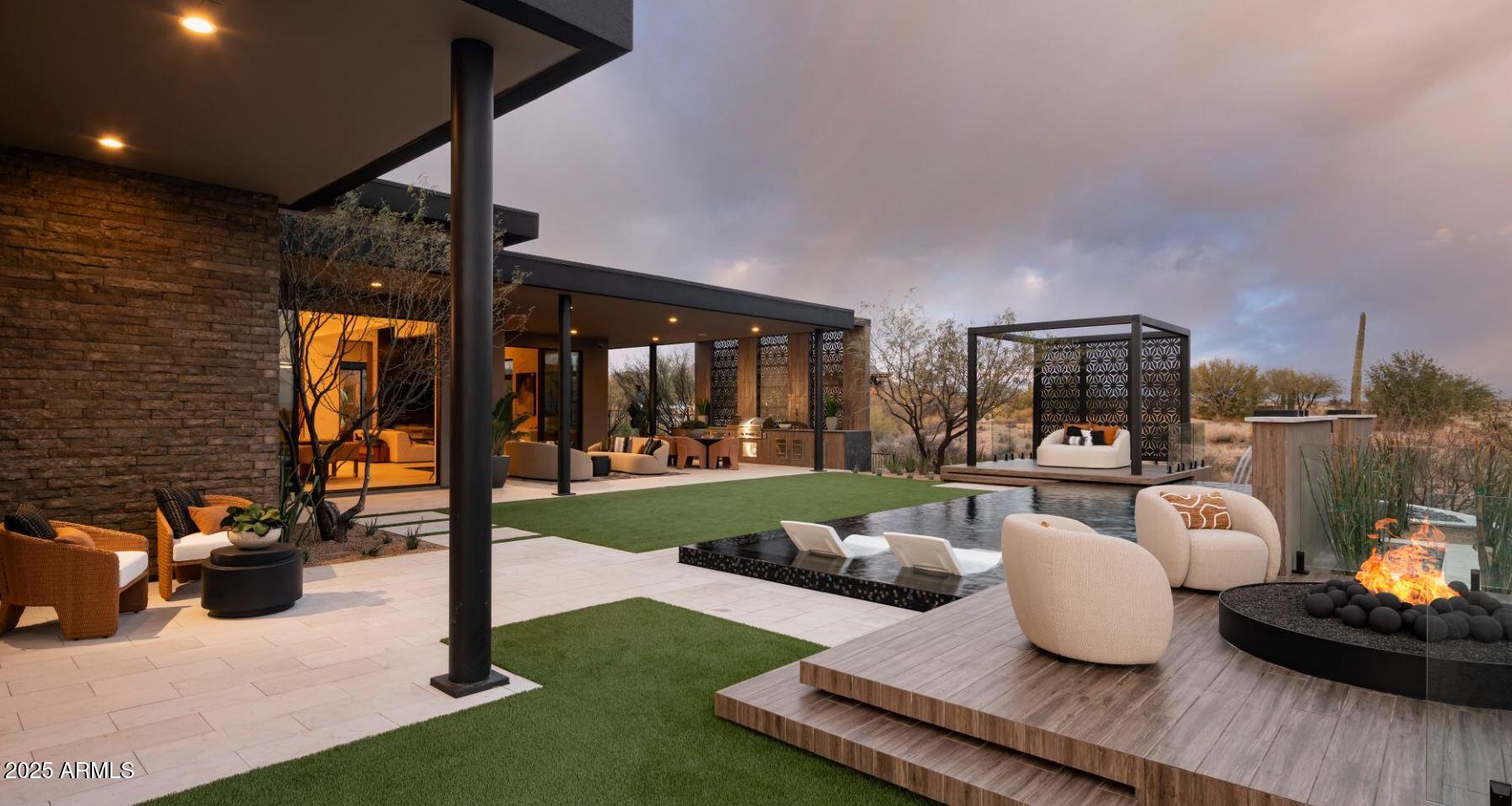 12602 East Chama Road, Unit 603 Scottsdale, AZ 85255 - Photo 10 of 11 a living room with furniture and a floor to ceiling window